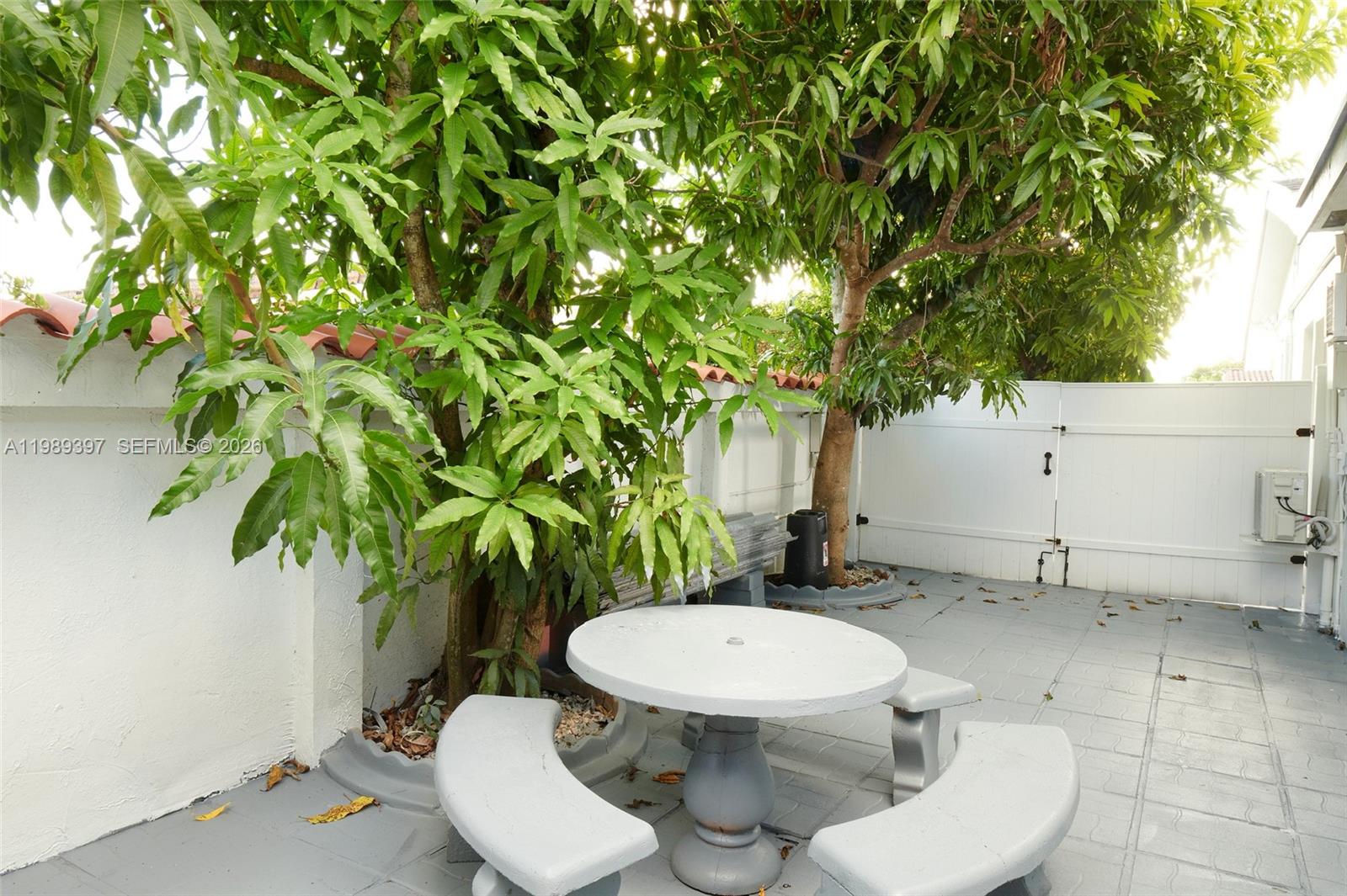 12293 Southwest 28th Terrace Miami, FL 33175 - Photo 22 of 25 a white toilet sitting in a backyard