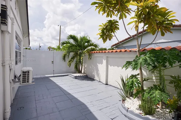 a view of a palm trees in front of a building