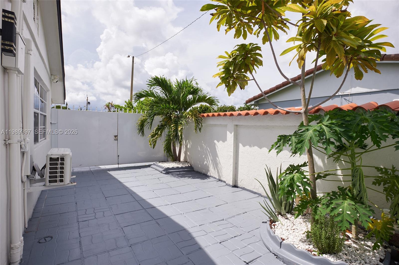 12293 Southwest 28th Terrace Miami, FL 33175 - Photo 6 of 25 a view of a palm trees in front of a building