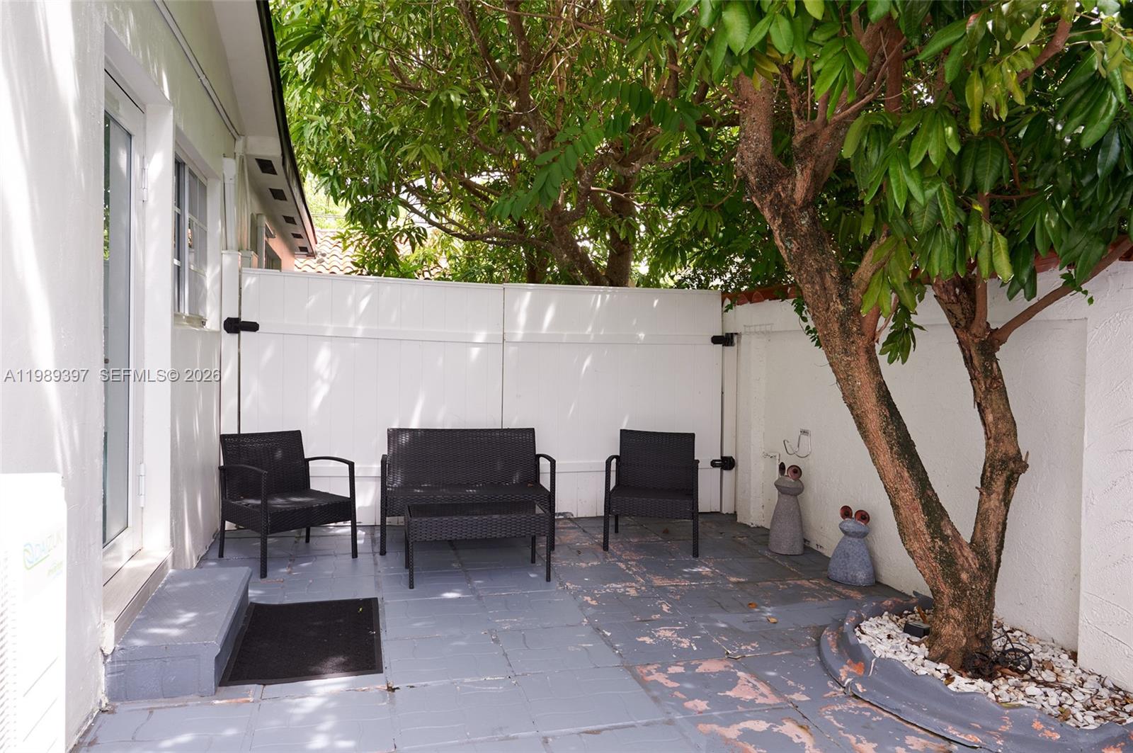 12293 Southwest 28th Terrace Miami, FL 33175 - Photo 7 of 25 a living room with furniture and a potted plant