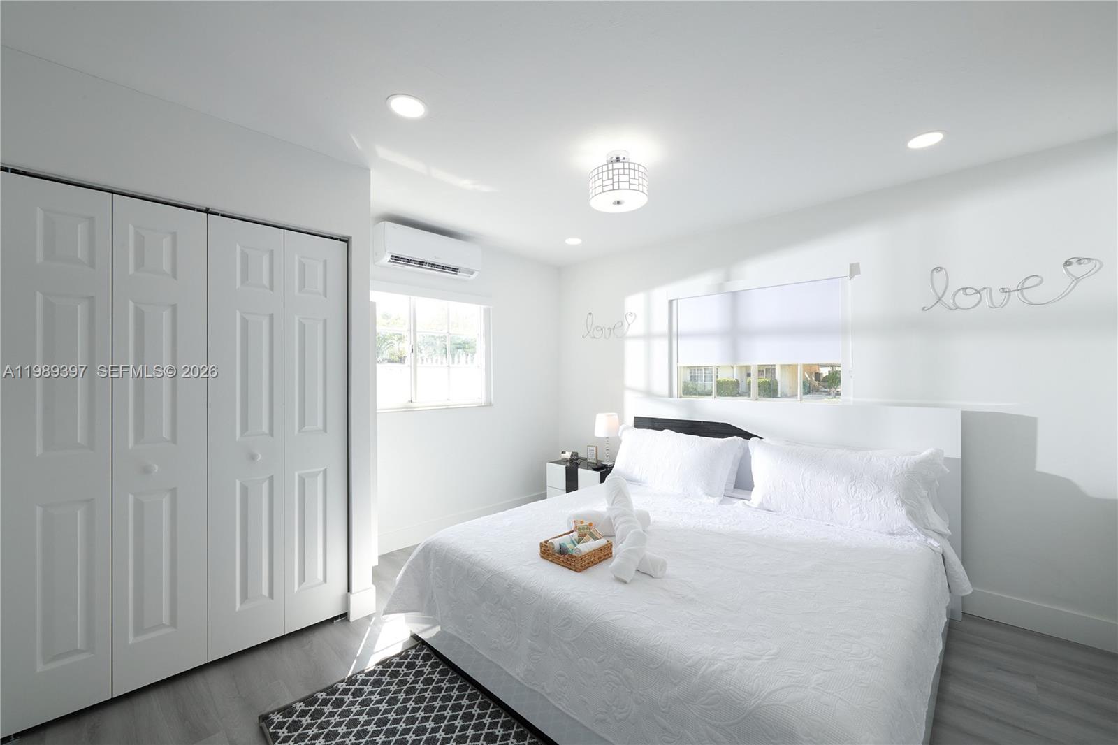 12293 Southwest 28th Terrace Miami, FL 33175 - Photo 10 of 25 a bedroom with a bed and a window