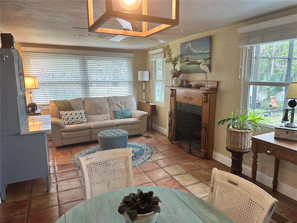 357 Magnolia Place DeBary, FL 32713 - Photo 16 of 50 a living room with furniture and a fireplace