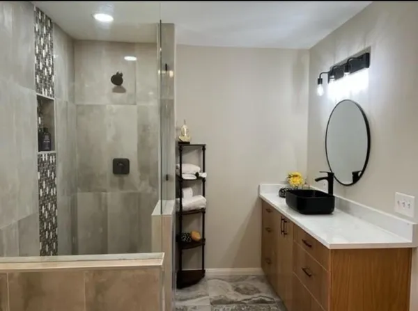 a bathroom with a double vanity sink and mirror
