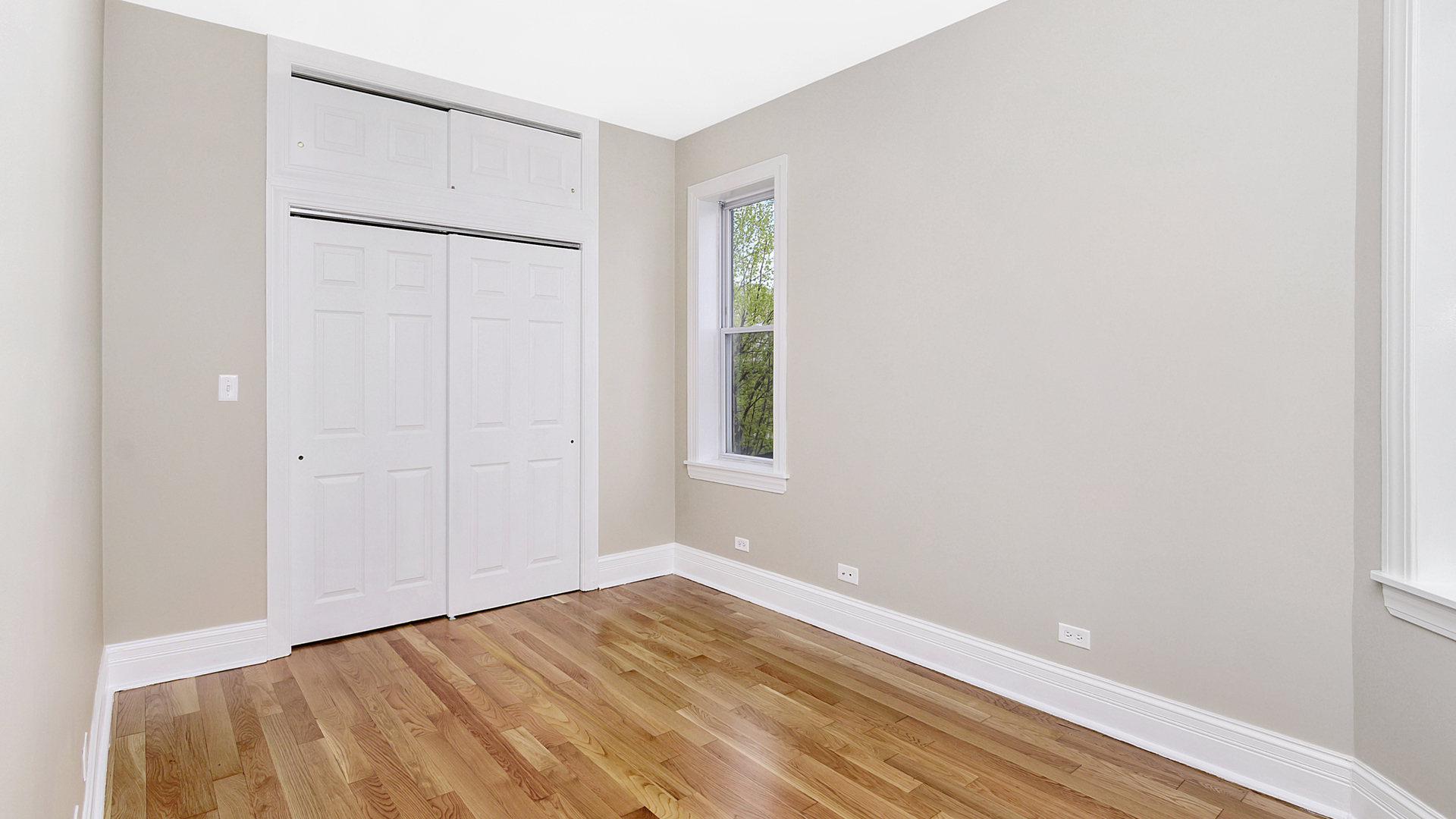 4918 South St Lawrence Avenue, Unit 3 Chicago, IL 60615 - Photo 11 of 16 a view of an empty room with wooden floor