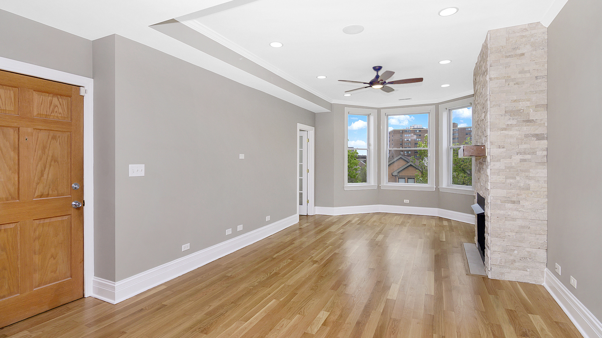 4918 South St Lawrence Avenue, Unit 3 Chicago, IL 60615 - Photo 3 of 16 wooden floor in an empty room with a window