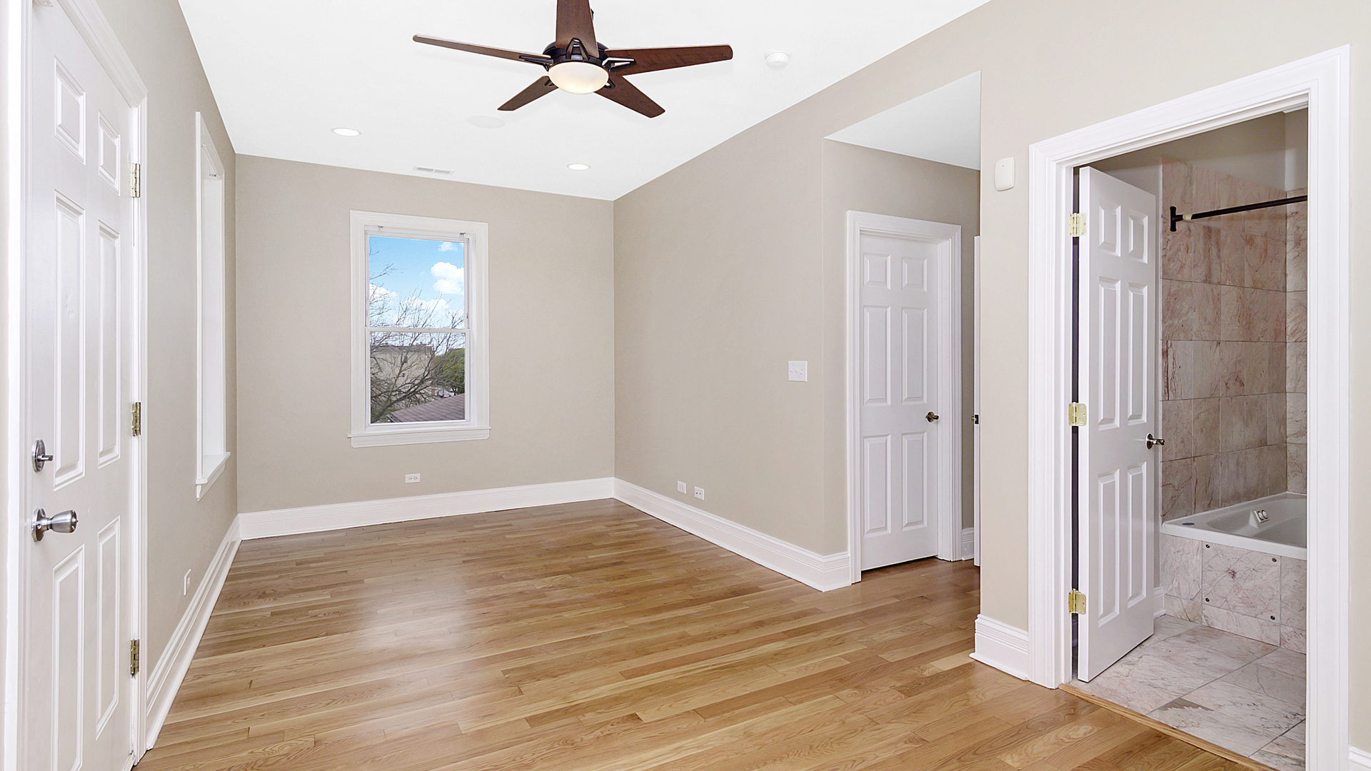 4918 South St Lawrence Avenue, Unit 3 Chicago, IL 60615 - Photo 8 of 16 a view of a room with wooden floor and window