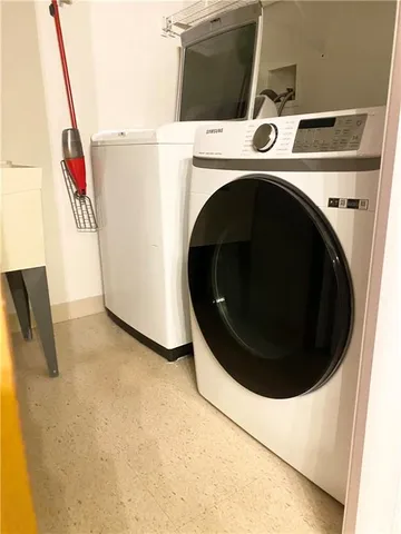 a utility room with dryer and washer