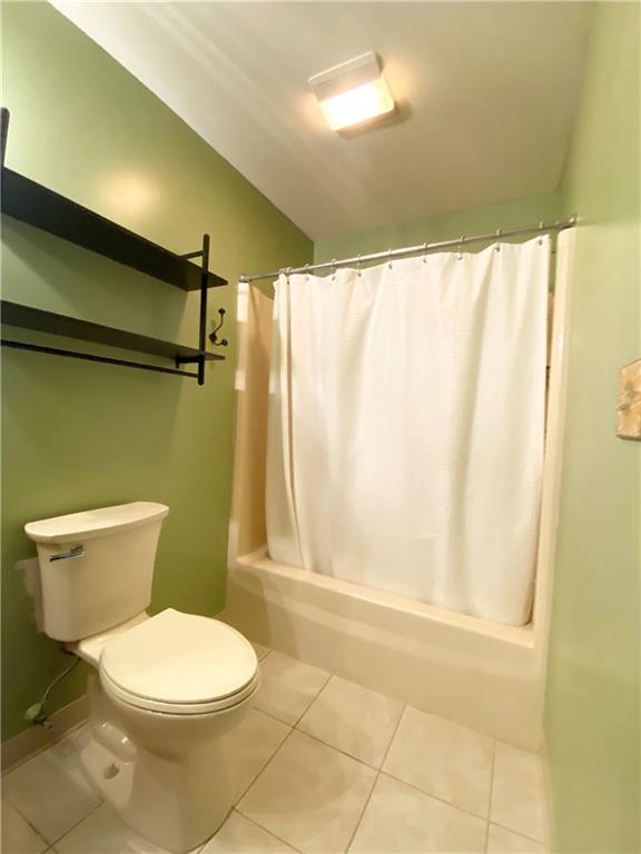 804 Barbra Lane New Castle, PA 16101 - Photo 10 of 16 a white toilet sitting next to a shower curtain