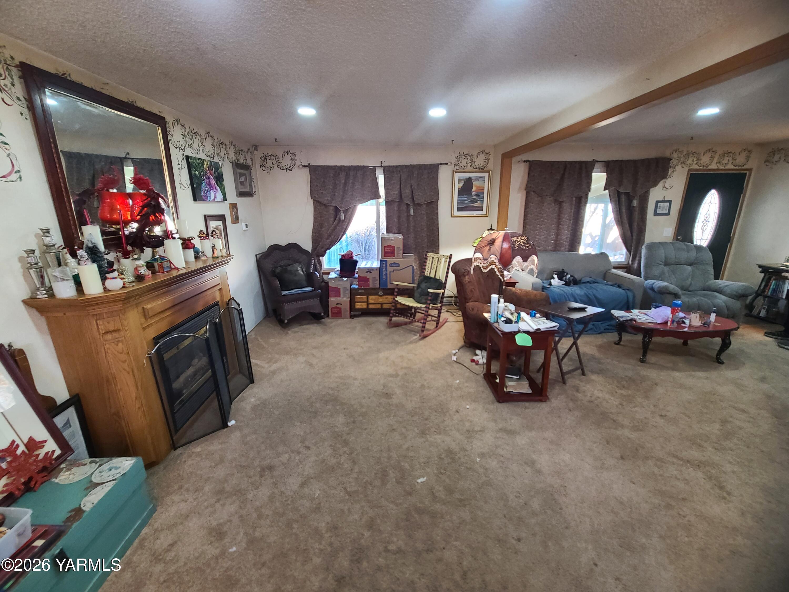 10608 Hackett Road Yakima, WA 98903 - Photo 5 of 25 a living room with furniture and a flat screen tv