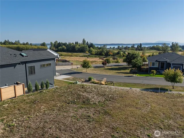 a aerial view of a house with a yard