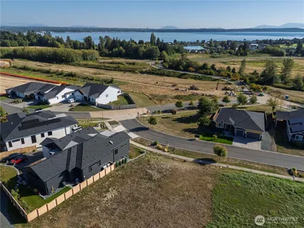 an aerial view of a houses with a yard