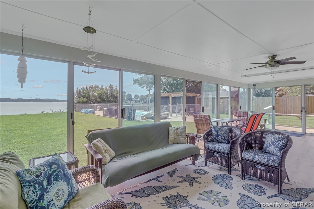 314 Callis Road Lancaster, VA 22503 - Photo 35 of 41 a living room with furniture and a floor to ceiling window