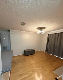 a view of a big room with wooden floor