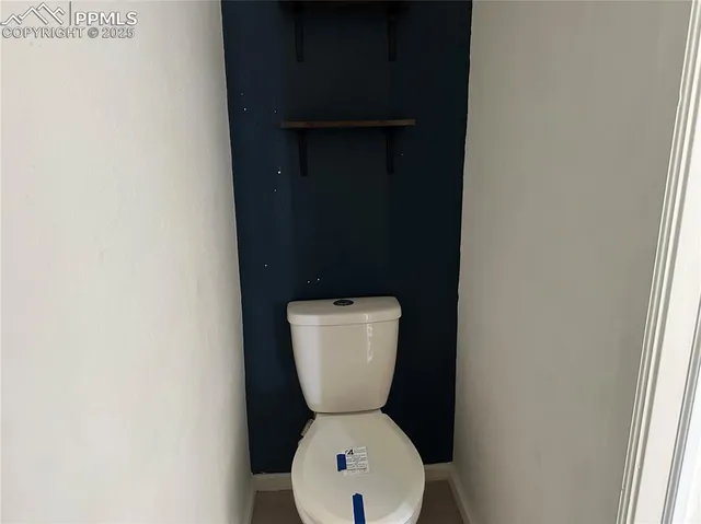 a bathroom with a toilet