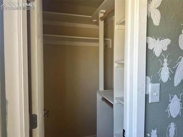 a bathroom with a sink vanity and a mirror