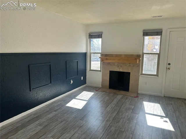 a living room with a fireplace