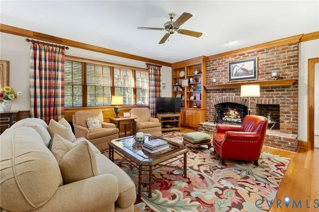 a living room with furniture fireplace and a flat screen tv