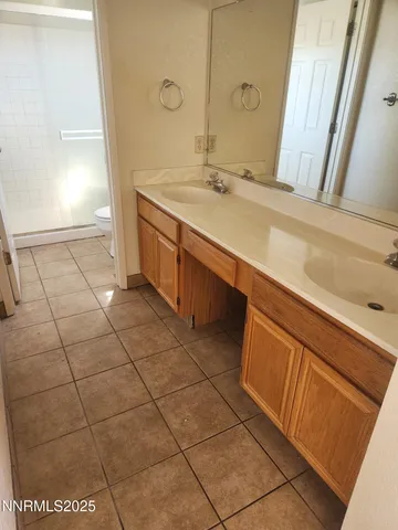 a bathroom with a sink a vanity and a mirror
