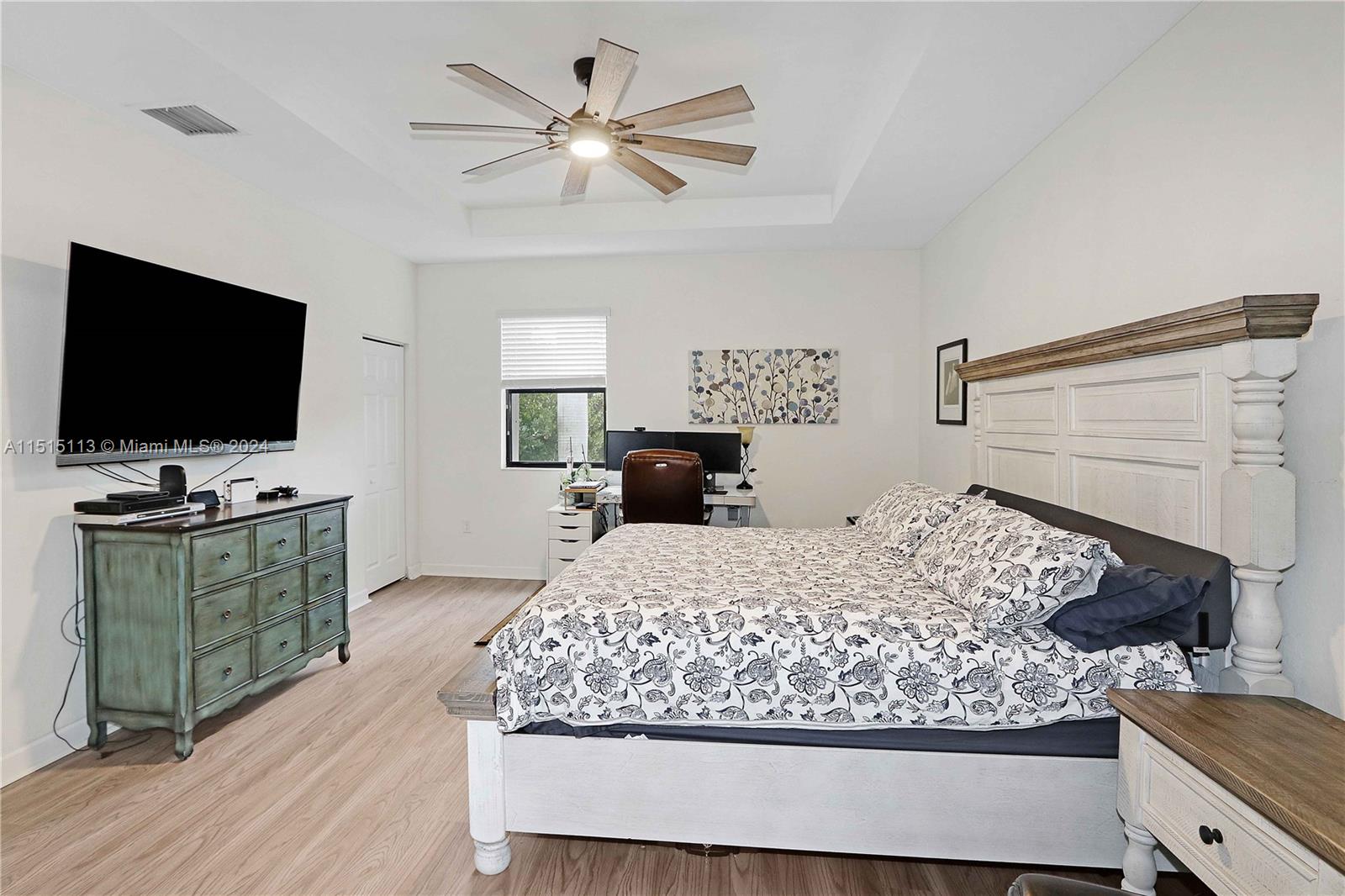 3448 Southeast 3rd Street Homestead, FL 33033 - Photo 14 of 27 a bedroom with a bed and a flat screen tv