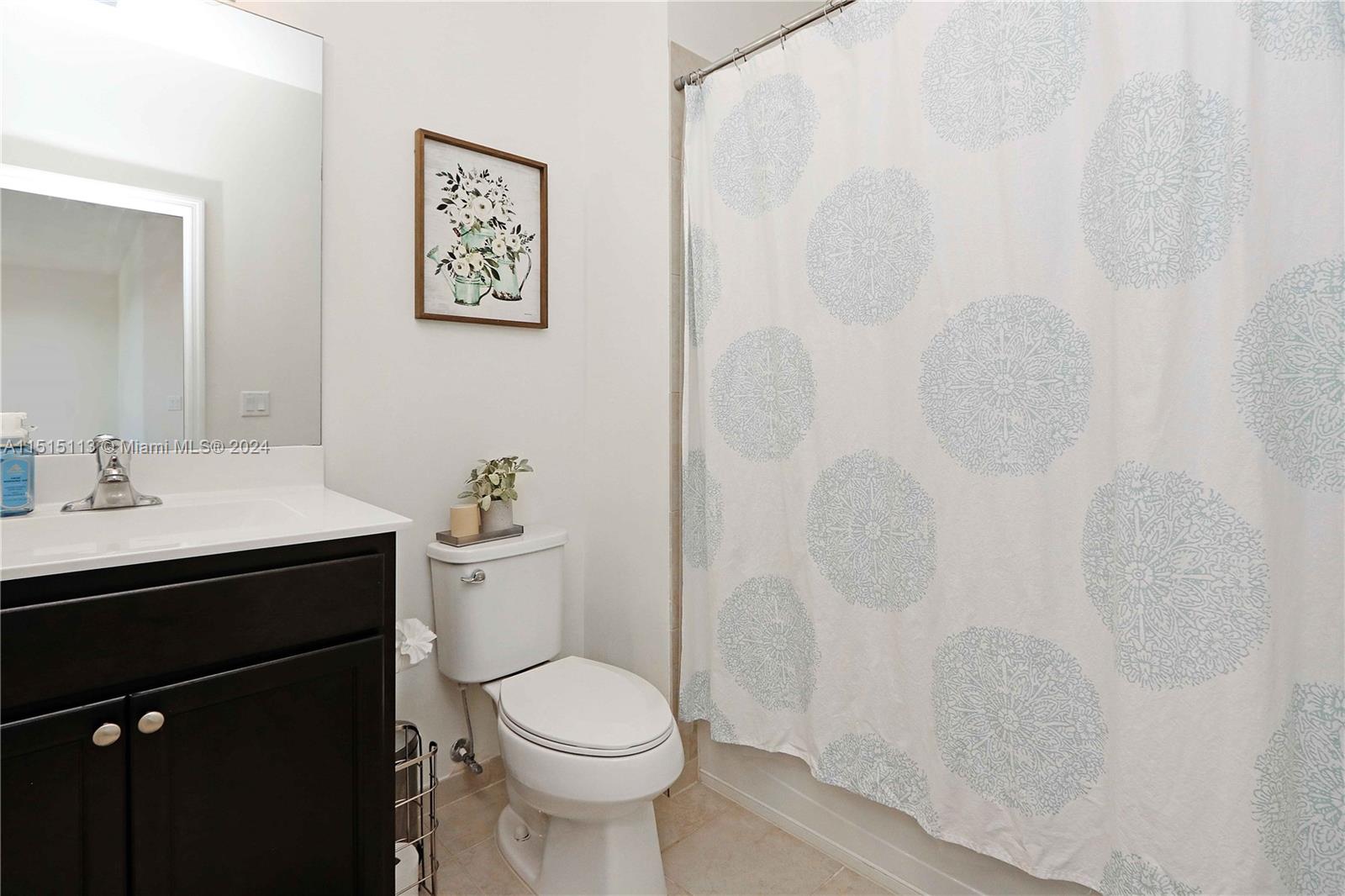 3448 Southeast 3rd Street Homestead, FL 33033 - Photo 18 of 27 a bathroom with a sink toilet and a mirror