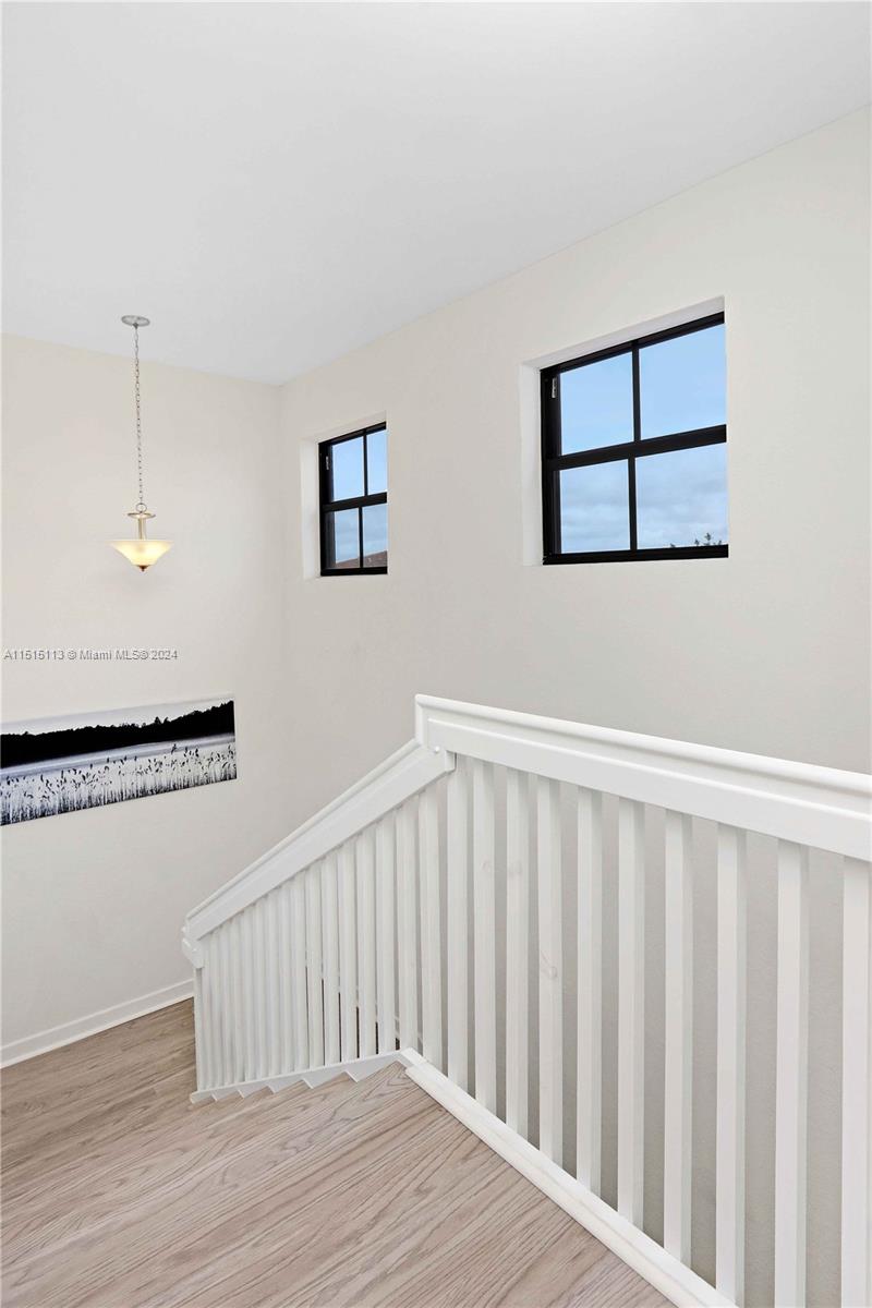3448 Southeast 3rd Street Homestead, FL 33033 - Photo 20 of 27 a view of a hallway with wooden floor