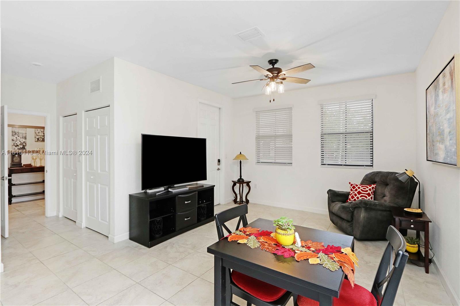 3448 Southeast 3rd Street Homestead, FL 33033 - Photo 21 of 27 a living room with furniture and a flat screen tv