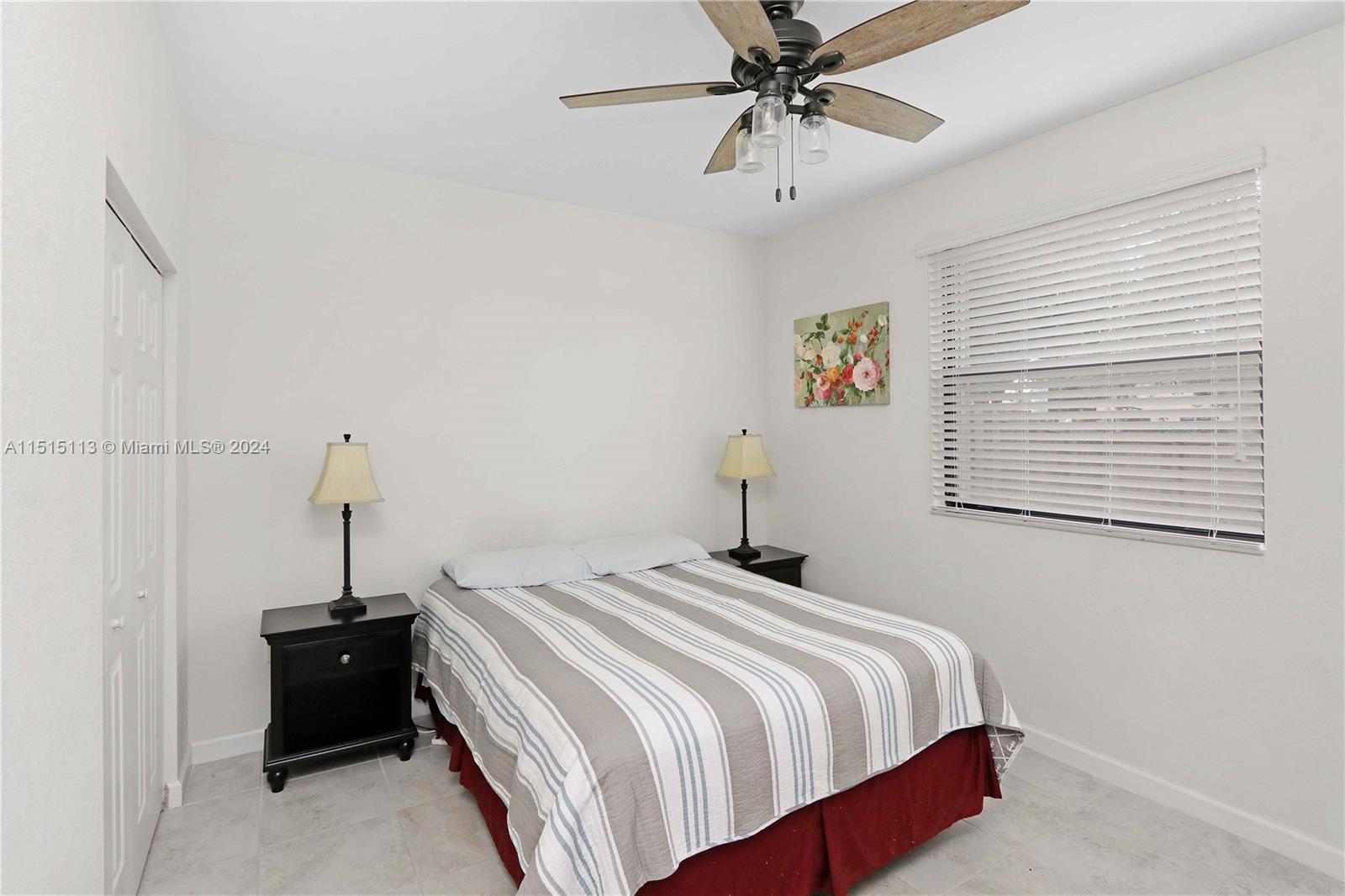 3448 Southeast 3rd Street Homestead, FL 33033 - Photo 23 of 27 a bedroom with a bed and a window