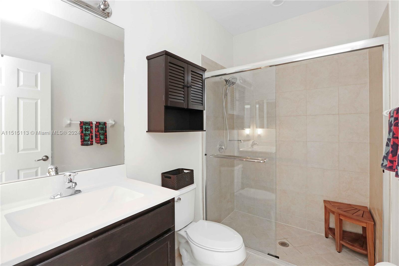 3448 Southeast 3rd Street Homestead, FL 33033 - Photo 24 of 27 a bathroom with a sink toilet a mirror and shower