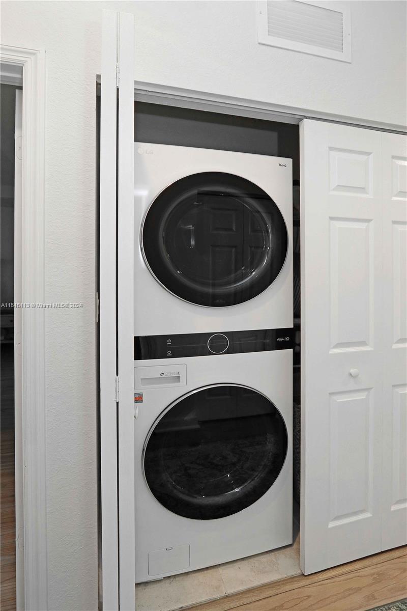3448 Southeast 3rd Street Homestead, FL 33033 - Photo 25 of 27 a utility room with dryer and washer