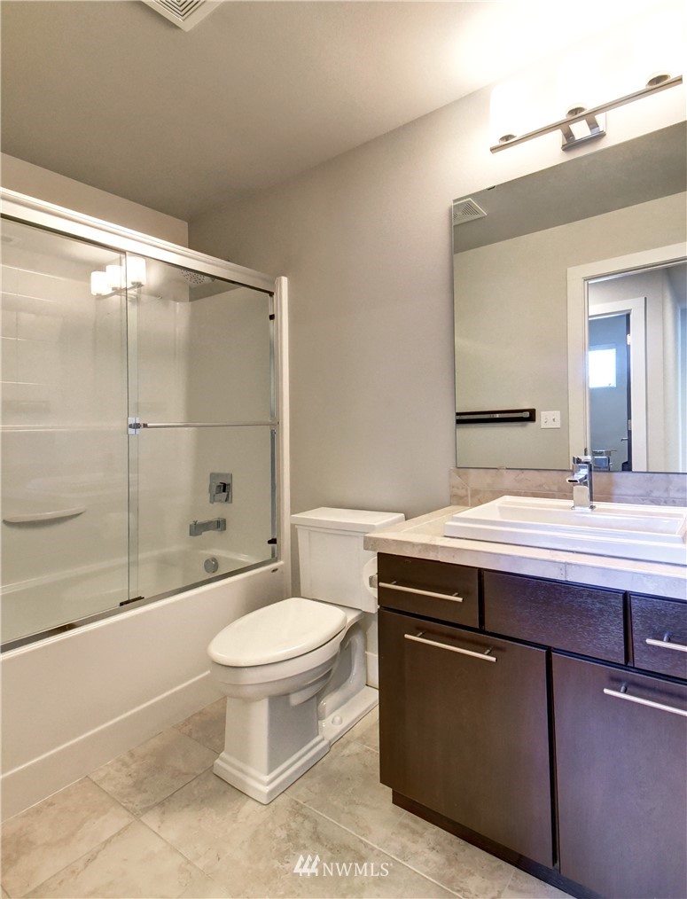 3422 181st Place Southeast Bothell, WA 98012 - Photo 13 of 22 a bathroom with a sink a toilet and shower