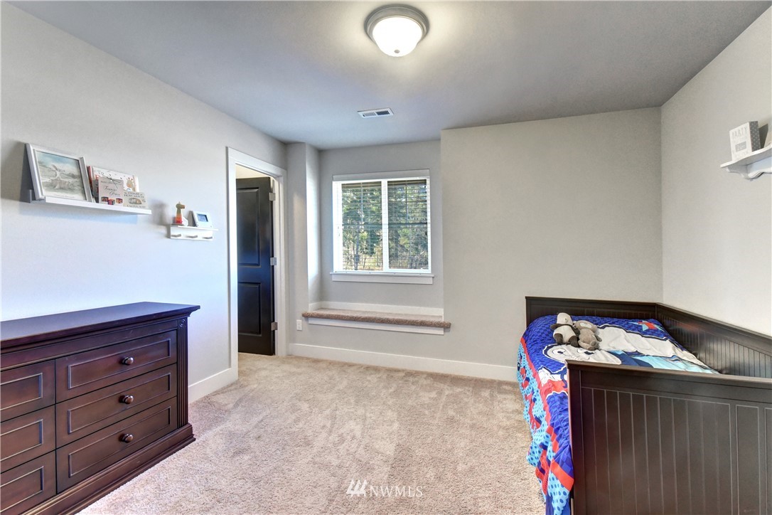 3422 181st Place Southeast Bothell, WA 98012 - Photo 14 of 22 a bedroom with a bed and a dresser