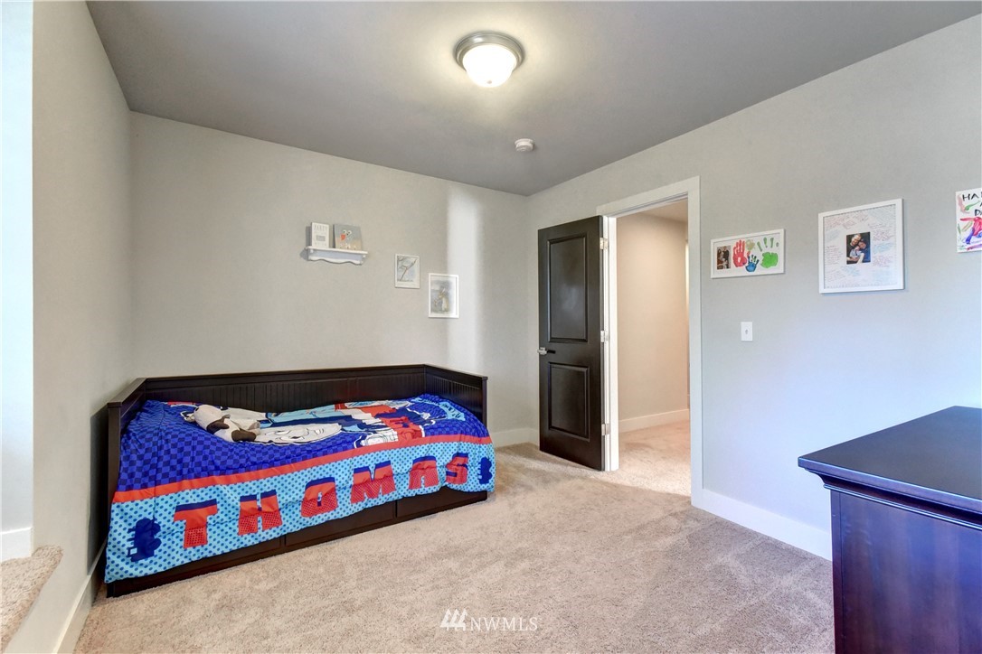 3422 181st Place Southeast Bothell, WA 98012 - Photo 15 of 22 a bedroom with a bed and a dresser