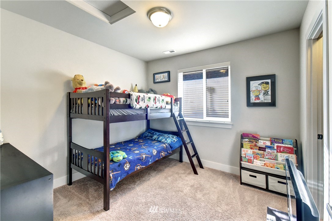 3422 181st Place Southeast Bothell, WA 98012 - Photo 17 of 22 a bedroom with a bed and a window