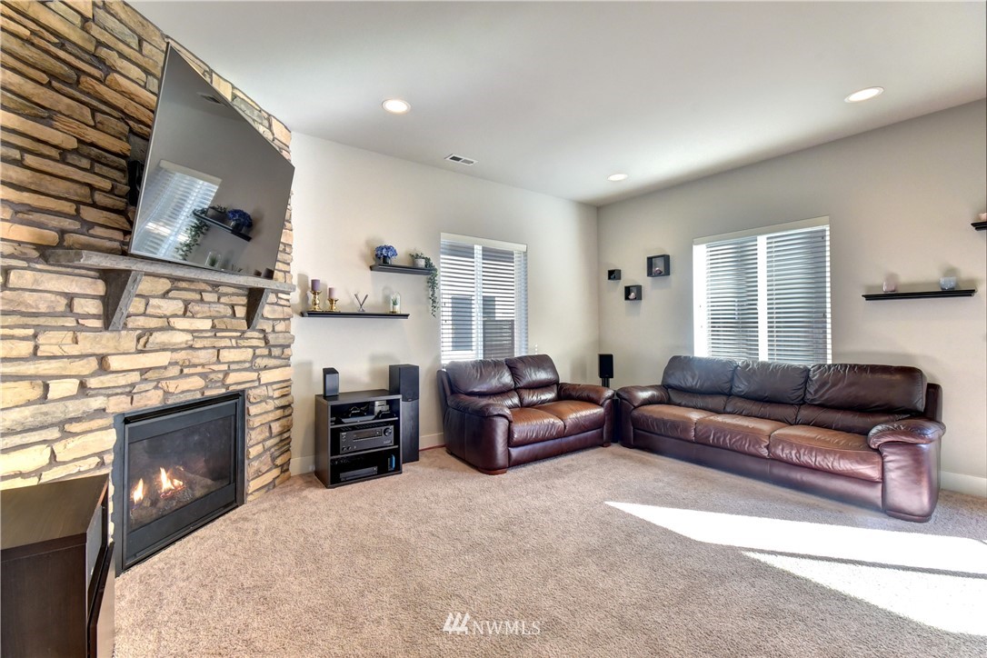 3422 181st Place Southeast Bothell, WA 98012 - Photo 8 of 22 a living room with furniture and a fireplace