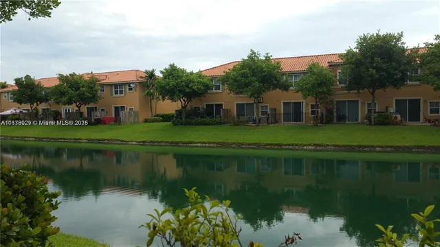 a front view of a house with a lake view
