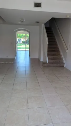 a view of a living room and floor to ceiling window