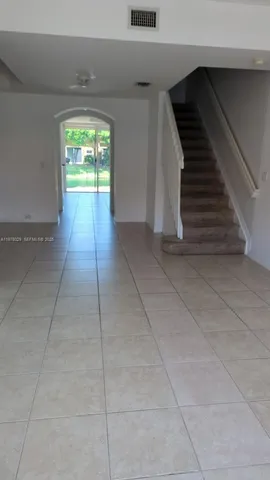 a view of a living room and floor to ceiling window