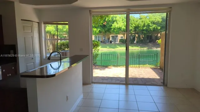 a kitchen with stainless steel appliances a refrigerator and a sink