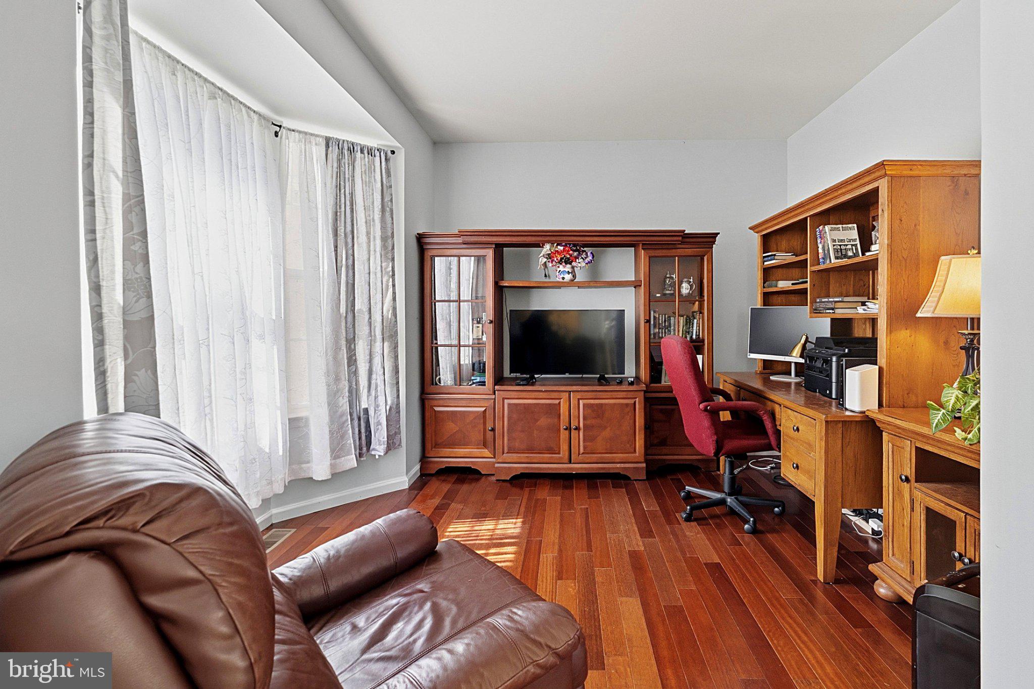 683 South Blue Bell Road Vineland, NJ 08360 - Photo 15 of 38 Cozy workspace with warm wood tones.