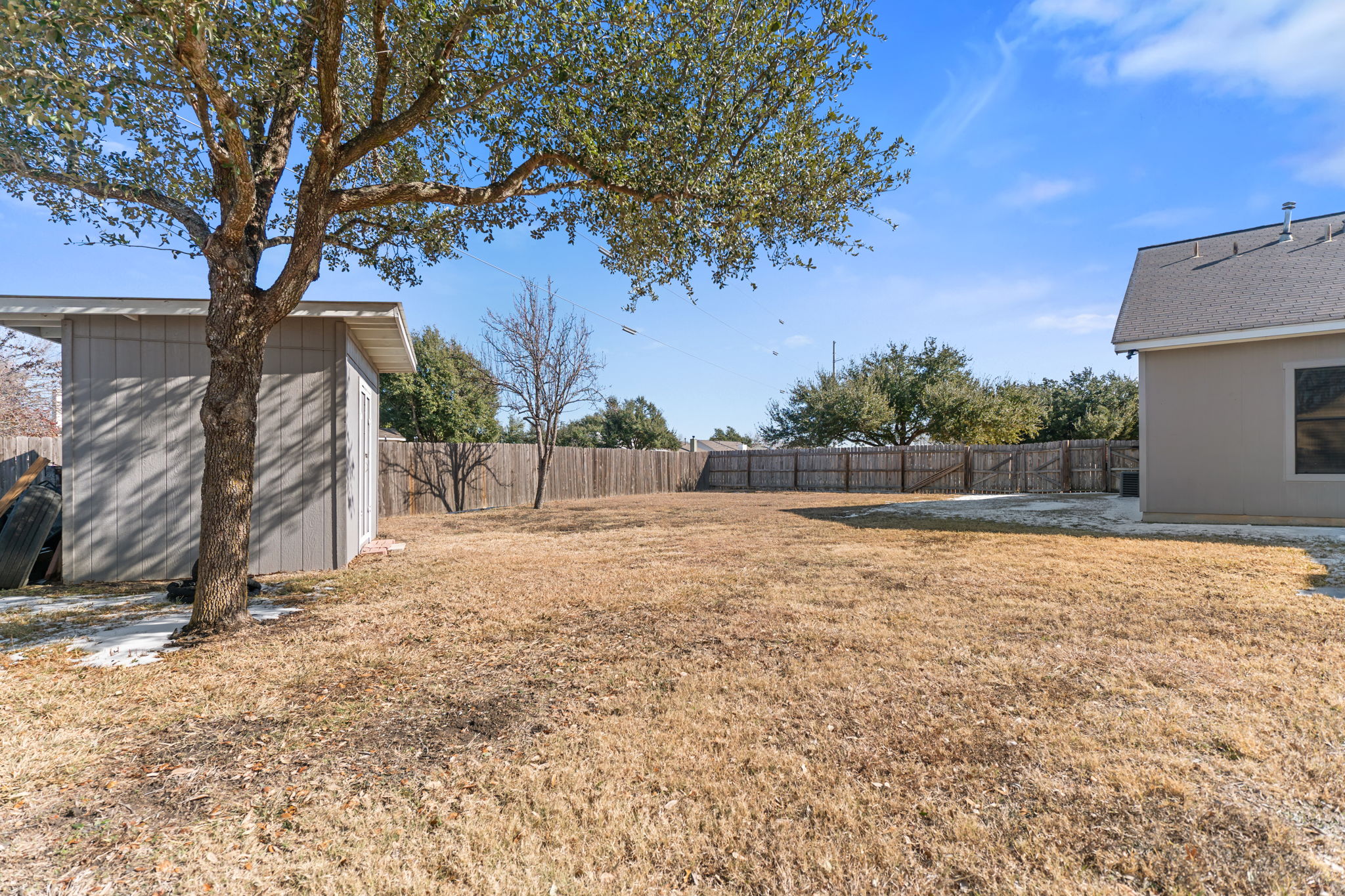 401 Kates Way Hutto, TX 78634 - Photo 35 of 37 Fenced backyard featuring a shed