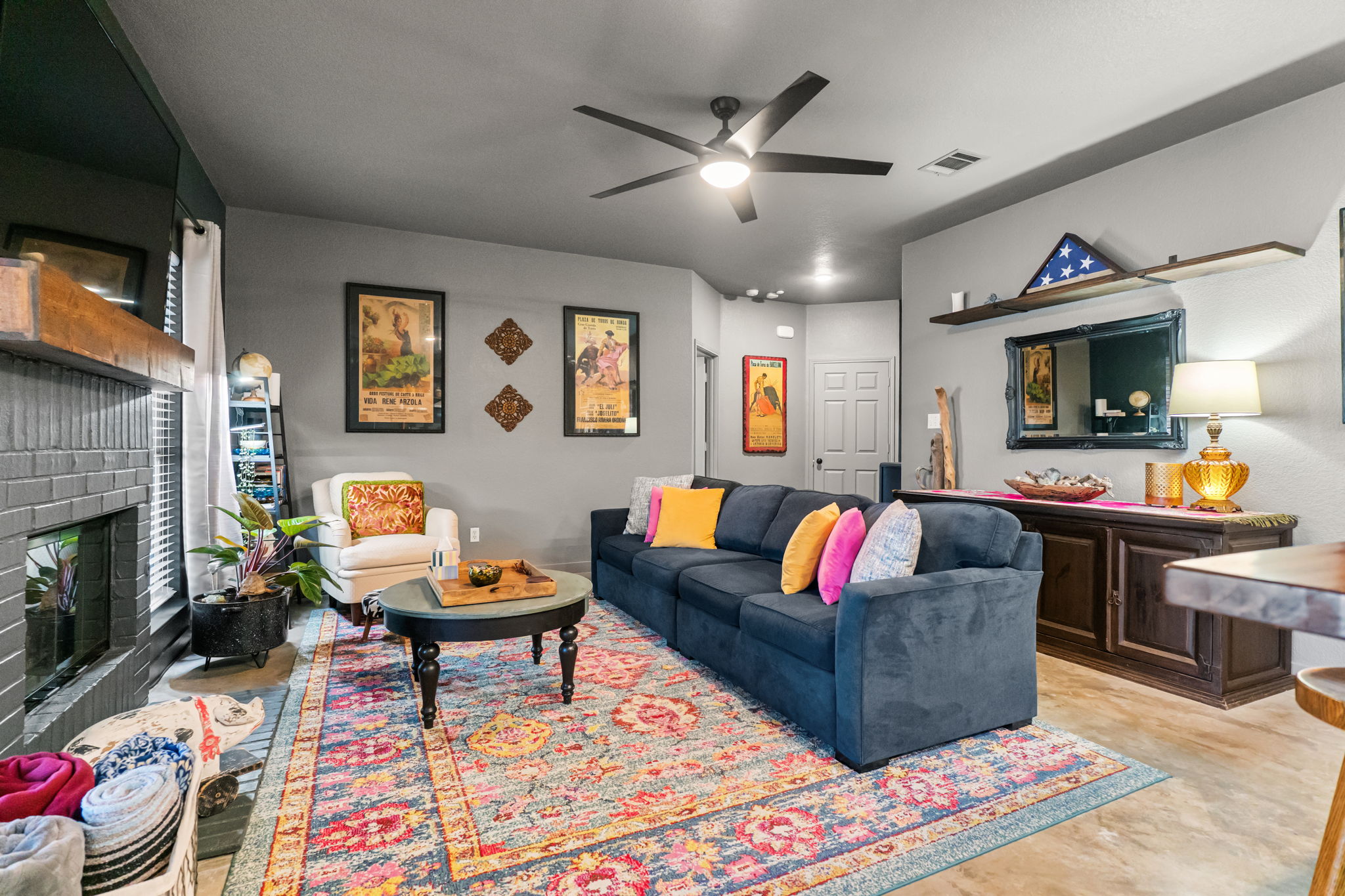 401 Kates Way Hutto, TX 78634 - Photo 7 of 37 Living area with a brick fireplace and ceiling fan