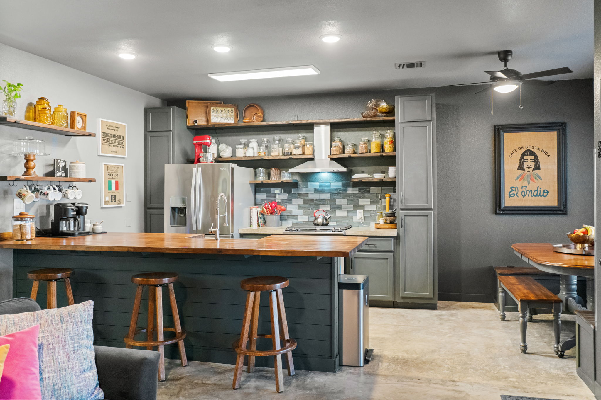 401 Kates Way Hutto, TX 78634 - Photo 9 of 37 Indoor wet bar featuring open shelves, butcher block countertops, concrete floors, and stainless steel fridge with ice dispenser