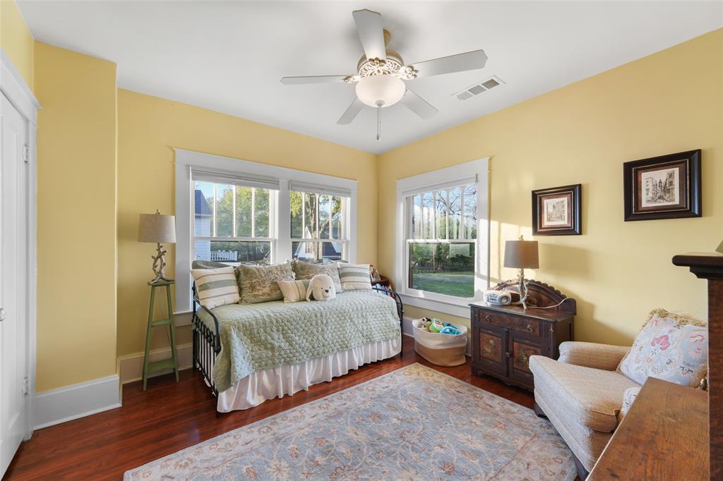 406 Griffith Avenue Terrell, TX 75160 - Photo 34 of 40 This room features hardwood floors, light yellow walls, and a ceiling fan