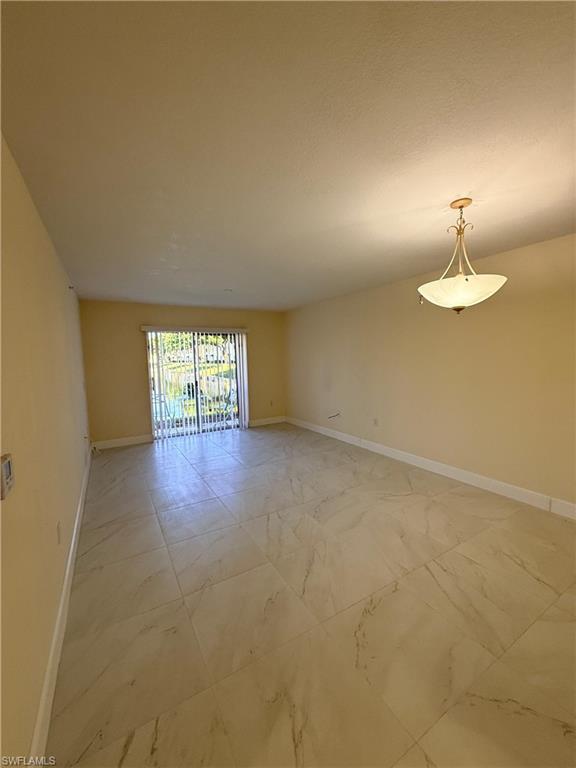 8274 Key Royal Circle, Unit 1012 Naples, FL 34119 - Photo 13 of 20 a view of empty room with window