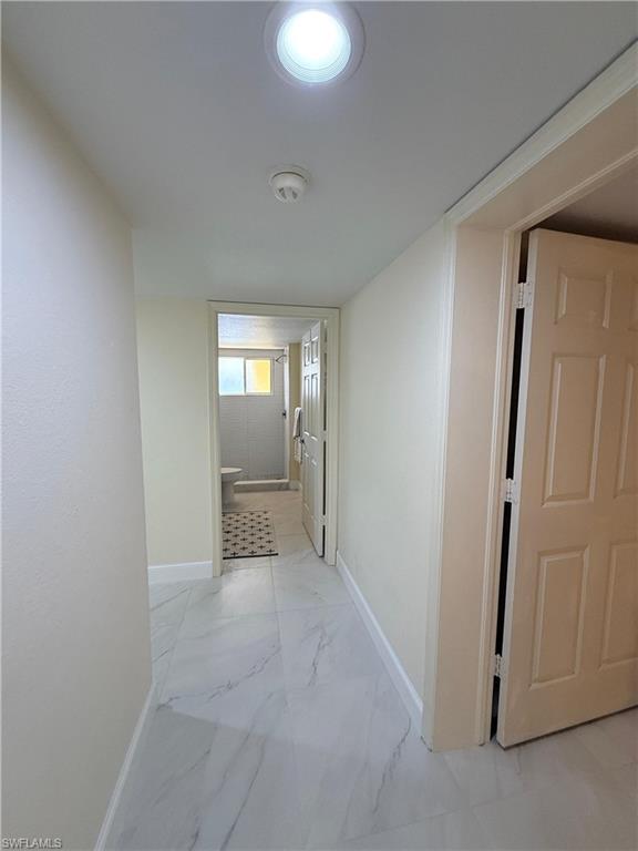 8274 Key Royal Circle, Unit 1012 Naples, FL 34119 - Photo 10 of 20 an empty room with windows and closet