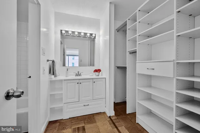 a bathroom with a double vanity sink and mirror