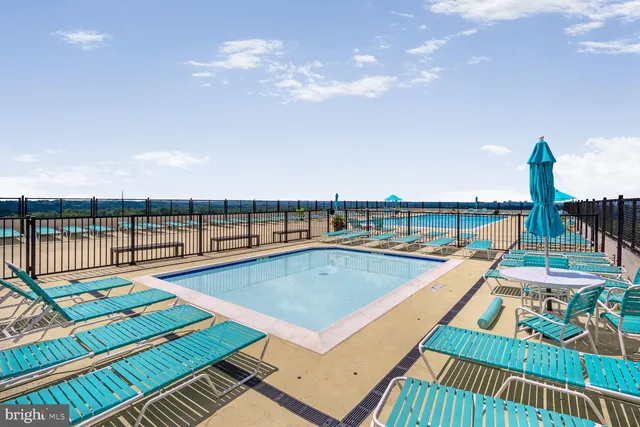 swimming pool view with sitting space and balcony view