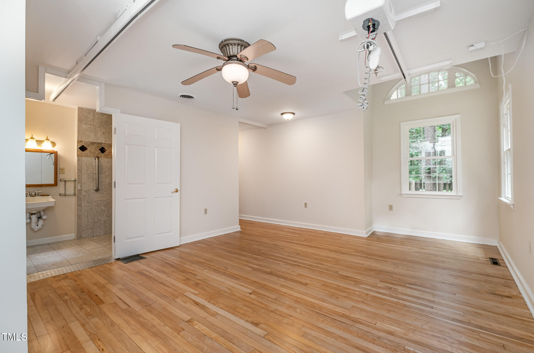 420 Lipscomb Grove Church Road Hillsborough, NC 27278 - Photo 13 of 27 wooden floor in an empty room with a window