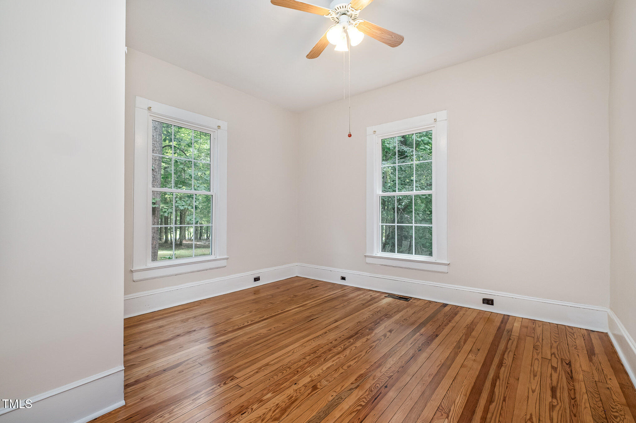 420 Lipscomb Grove Church Road Hillsborough, NC 27278 - Photo 15 of 27 a view of an empty room with wooden floor and a window