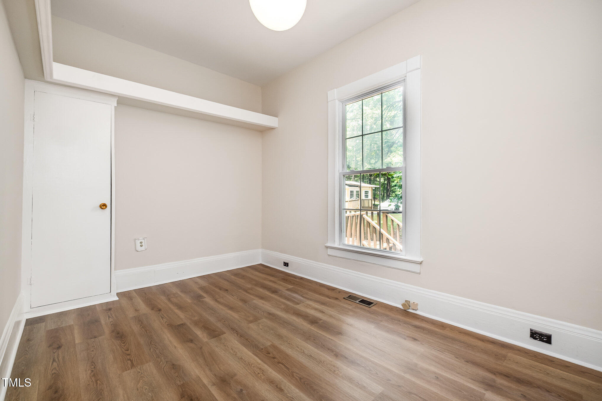 420 Lipscomb Grove Church Road Hillsborough, NC 27278 - Photo 17 of 27 an empty room with wooden floor and windows